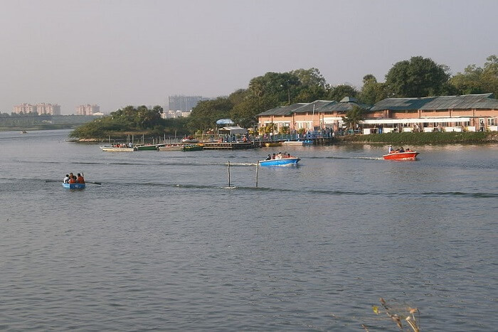 people riding a boat in the lake